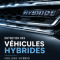 Véhicule hybride en entretien avec des outils