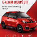 Aixam E-Aixam eCOUPÉ GTI électrique garée dans un environnement urbain, soulignant son design moderne.