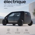 Image d'une voiture Biomega électrique sur une route moderne, symbolisant innovation et écologie.